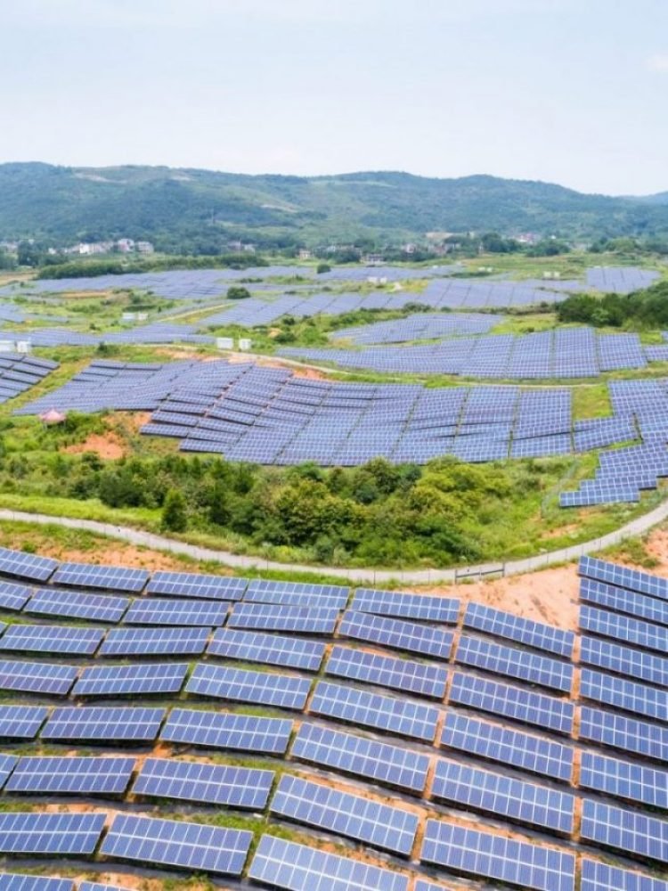 solar-power-station-on-hillside-aerial-view-of-renewable-energy-e1641313682337